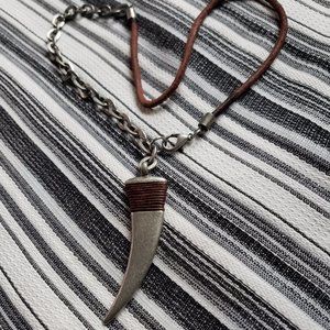 Modern stylized shark tooth pendant necklace